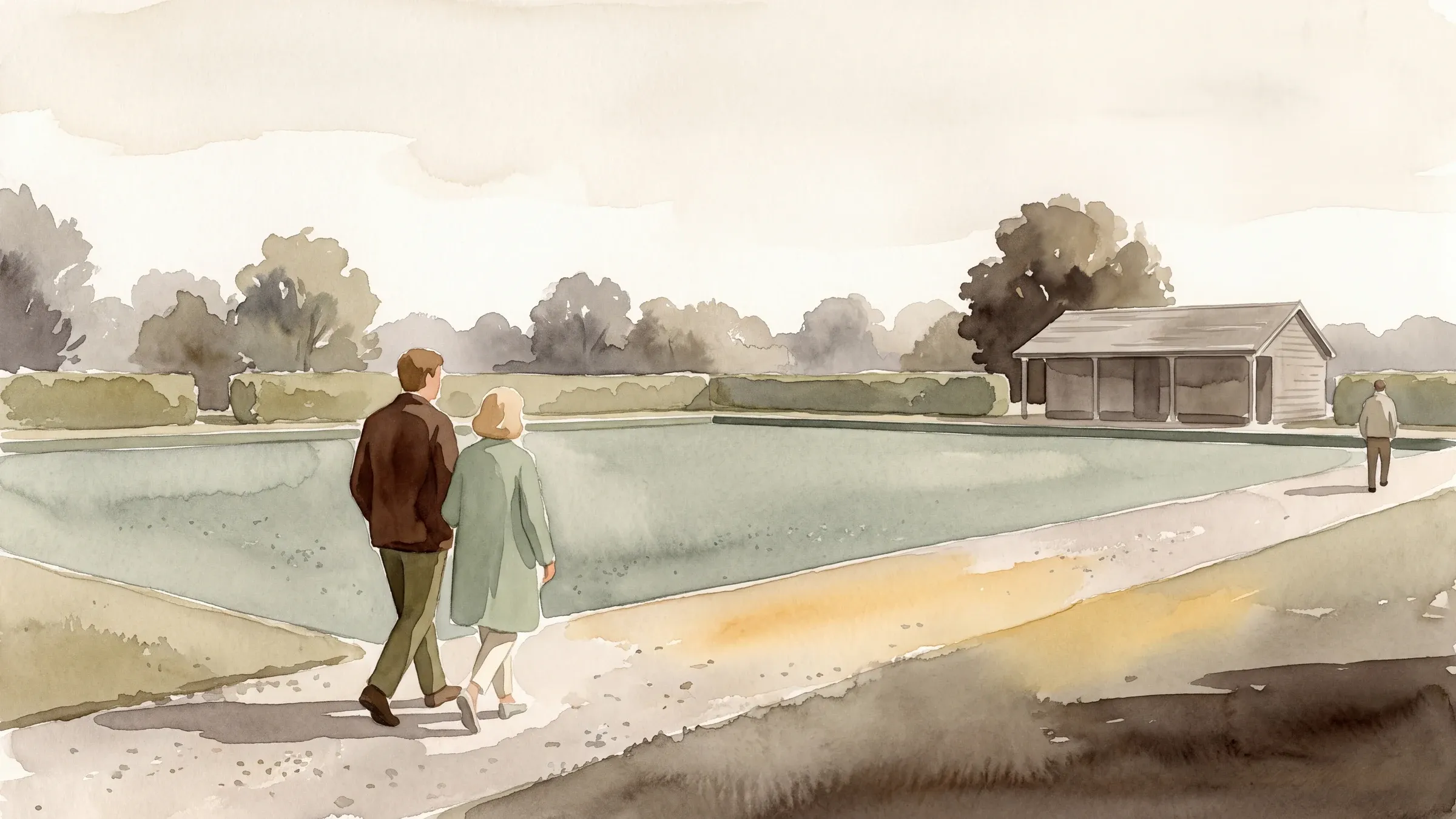A watercolour illustration of two people walking a gravel path beside an empty municipal bowling green, with a low pavilion beyond.